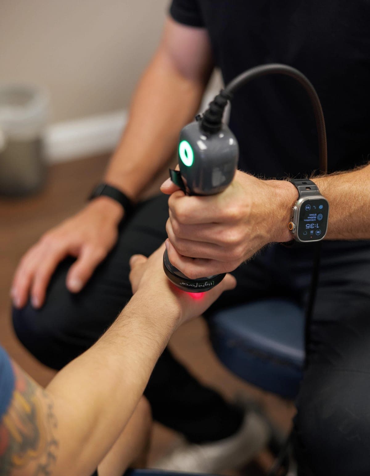 Class IV laser therapy being applied to a patient's wrist