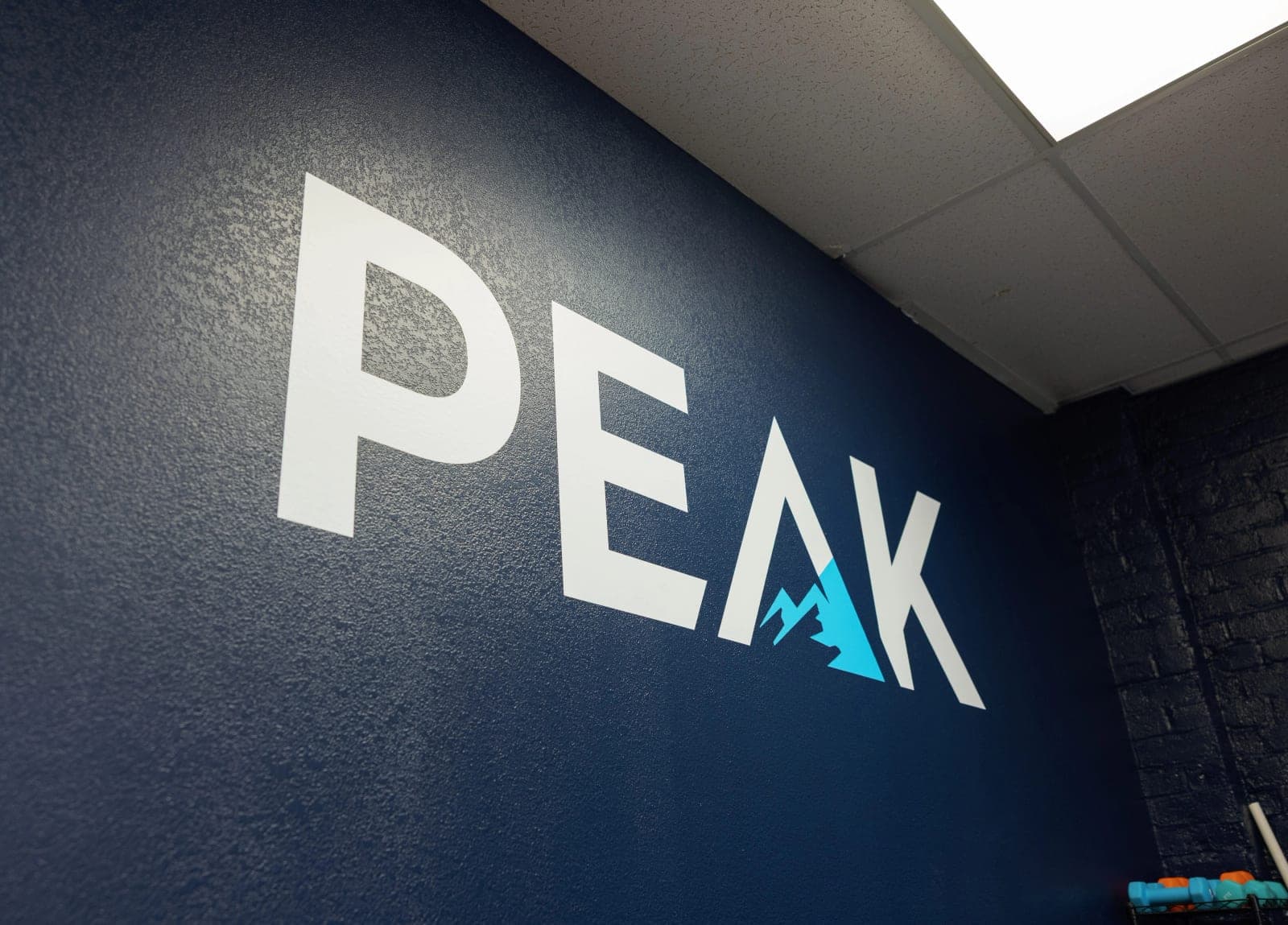 The Peak mark on the clinic wall at 5700 J Street